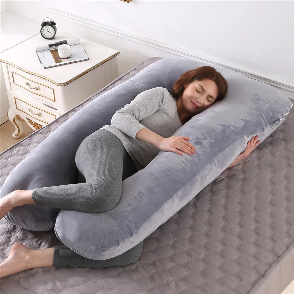 Soft and versatile body pillow that can also be used as a nursing and breastfeeding support cushion after childbirth for improved comfort and positioning.