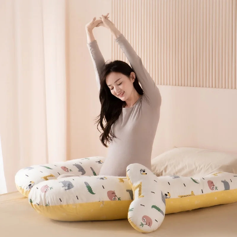 Body pillow designed to reduce pressure and provide comfort for expectant mothers