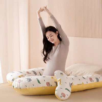 Body pillow designed to reduce pressure and provide comfort for expectant mothers