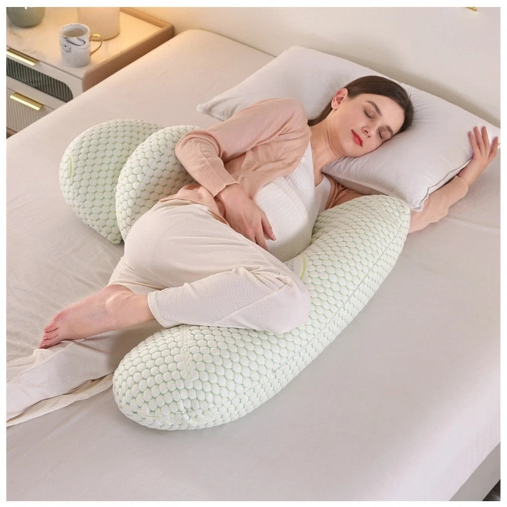 Large pregnant body pillow cushion with detachable and adjustable support sections for belly, back, legs, and hips during sleep.